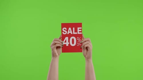 Sale 40 Percent Off Advertisement Inscription on Paper Sheet in Womans Hands on Chroma Key