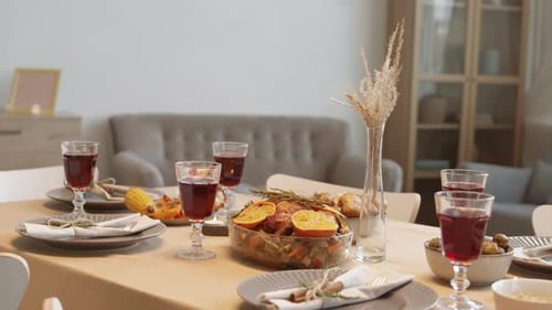 Thanksgiving Dinner Table with Roasted Turkey and Wine