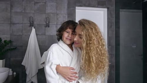Mother and Child Embrace in Bathroom