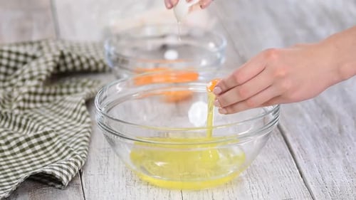 Separating Egg Yolk and White in Bowl