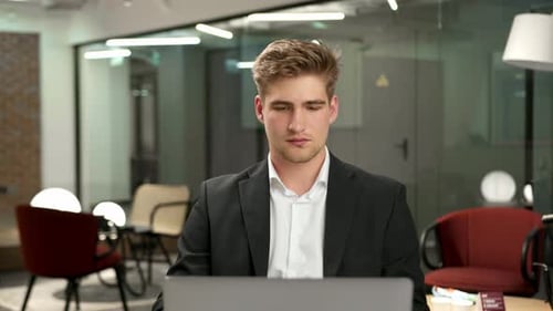 Male office worker communicates in zoom with work colleagues or clients