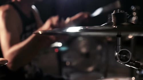 Drummer playing plates on concert close up