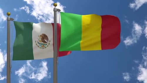 Waving Flags of Mexico and Mali Against Blue Sky