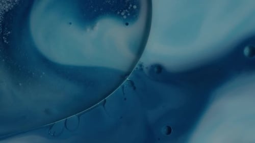 Abstract Swirling Blue Liquid and Bubbles