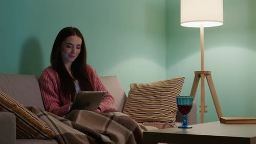Woman Is Relaxing With Gadget