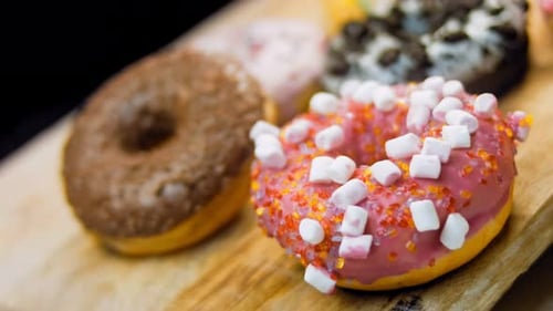 Delicious Donuts with Colorful Toppings Close Up