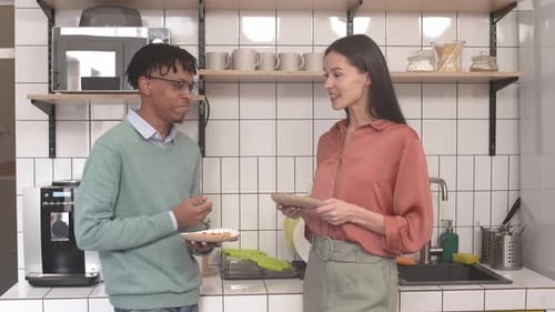 Man and Woman Talking in a Kitchen
