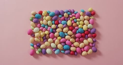 Colorful Candy Eggs Still Life on Pink Background