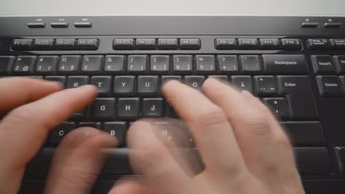 Man typing on a keyboard. Close up. Timelapse