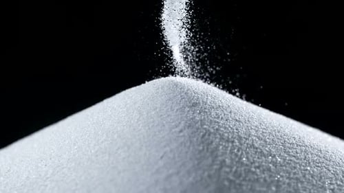 Pile of white sand on black backgroud, Slow Motion
