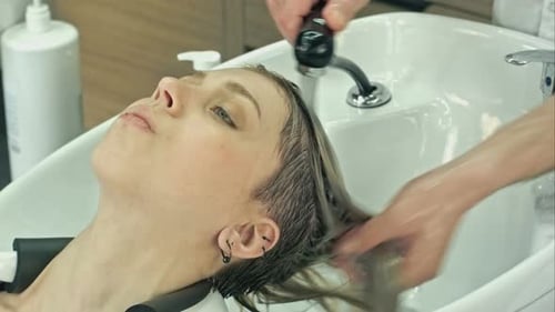 Woman Getting Hair Washed at a Salon