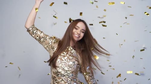 Woman Dancing in Confetti at a Birthday Party