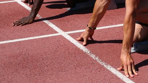 Sprinters Ready at Starting Line on Track