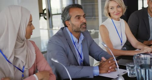 Business Professionals Conferring During a Meeting