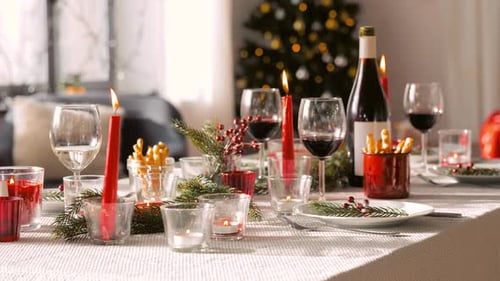 Table Set for Christmas Dinner with Candles and Wine