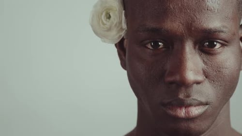 Close Up Portrait of Male with Flower