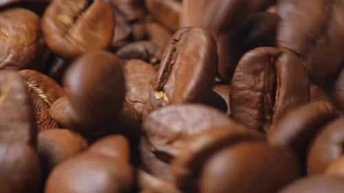 Close Up of Falling Roasted Coffee Beans