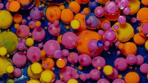 Vibrant Bubbles of Color Floating in Liquid
