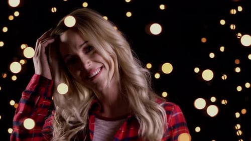 Smiling Woman in Front of Bokeh Lights