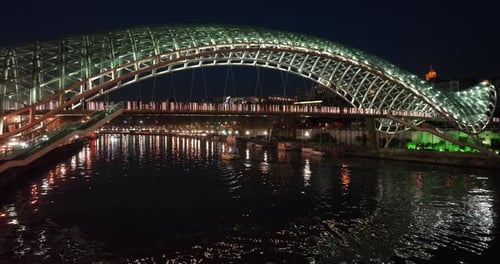 Aerial view of Tbilisi city central park and Bridge of Peace. Beautiful cityscape of old Tbilisi