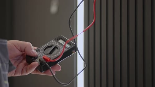 Hand Using Multimeter Close Up