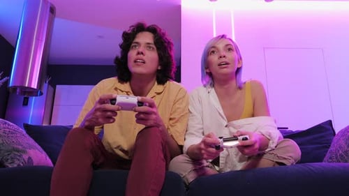 Young Couple Playing Video Games Together at Home