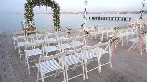 Wedding Venue Decorated on Deck by the Ocean