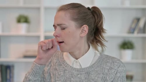Woman Coughing Indoors, Close Up