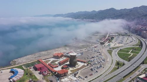 Aerial View of Coastal Cityscape with Fog