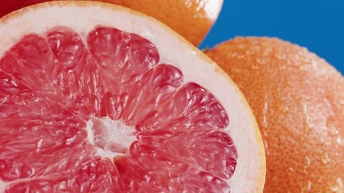 Macro Shot of Grapefruit Half with Water Droplets