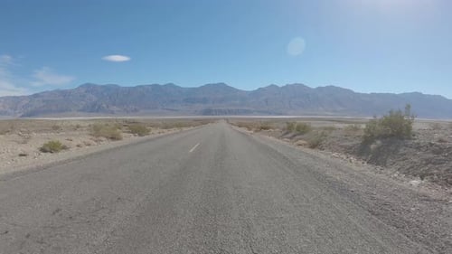 Empty desert road at Death Valley, California, USA