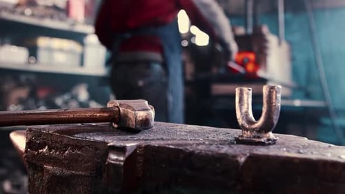 Blacksmith Anvil and Tools in a Workshop