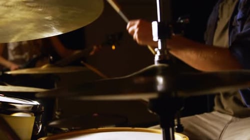 Drummer playing drum in studio