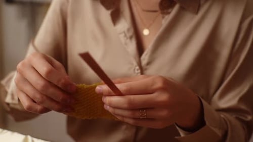 Woman Rolling Wax to Create Handmade Candle