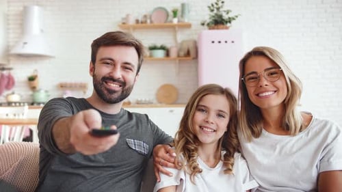 Cheerful Family Smiling Together at Home