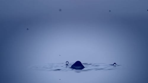 Abstract Liquid Drop Impact on Blue Background