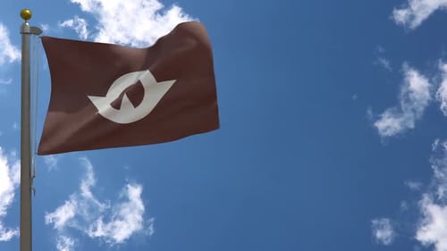 Waving Brown Flag with Abstract Symbol Against Blue Sky