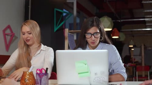 Two Woman Working Hard in Office