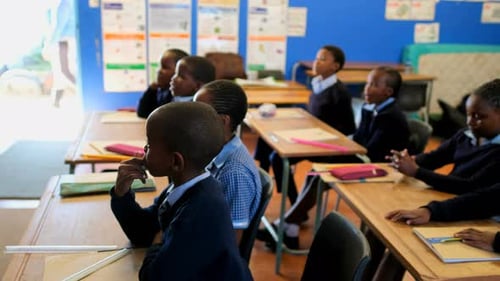 Children Attending Class in School Classroom