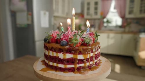 Festive Red Velvet Cake with Berries and Candles