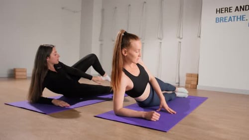 Two Women Doing Core Exercise on Fitness Mats