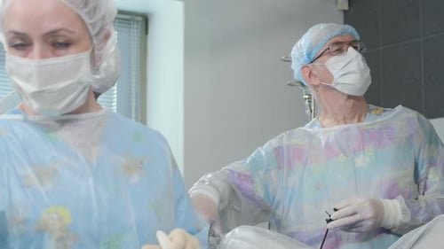 Medical Team Performing Surgical Procedure in Operating Room