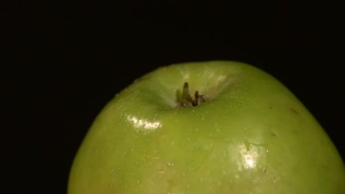 Top of Green Apple Isolated on Black, Rotation