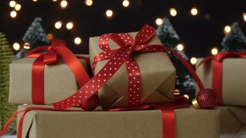 Christmas Gifts with Red Ribbons and Fairy Lights
