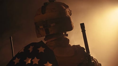 Military Soldier with American Flag in Smoky Setting