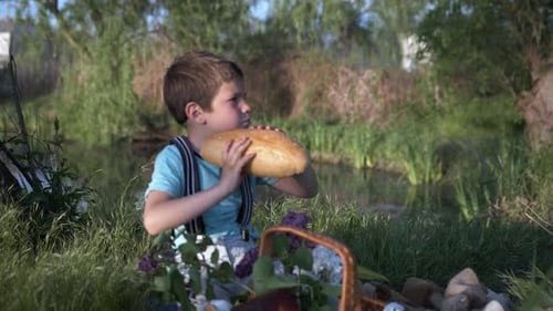 Happy Boy Enjoys Picnic with Bread and Milk