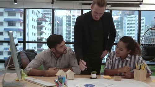 Creative Business People Group Having Conversation at Office Desk in Workplace