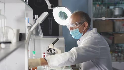 Scientist Working in Brightly Lit Laboratory