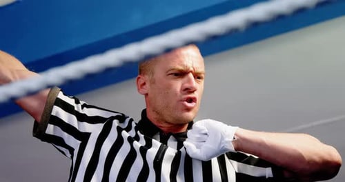 Portrait of confidence referee in fitness studio