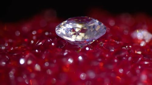 Macro of a Sparkling Diamond on Red Faceted Surface